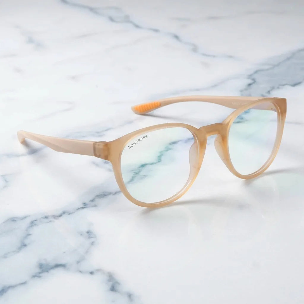 Lentes ópticos Ashley Peach sobre mármol blanco elegante armazón premium Bonoboss #editorial_armazon #color_peach