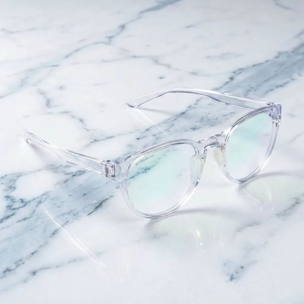 Lentes ópticos Ashley Transparente sobre mármol blanco elegante armazón premium Bonoboss #editorial_armazon #color_transparente