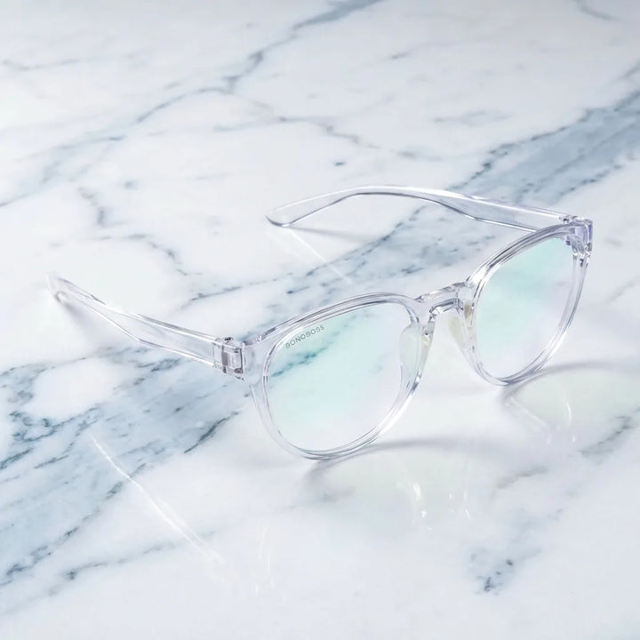 Lentes ópticos Ashley Transparente sobre mármol blanco elegante armazón premium Bonoboss #editorial_armazon #color_transparente