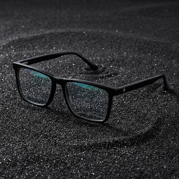 Lentes ópticos Condor Negro sobre arena volcánica texturizada diseño sustentable Bonoboss #editorial_sustentabilidad #color_negro