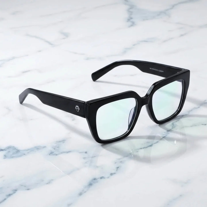 Lentes ópticos Kai Kai Negro sobre mármol blanco elegante armazón premium Bonoboss #editorial_armazon #color_negro