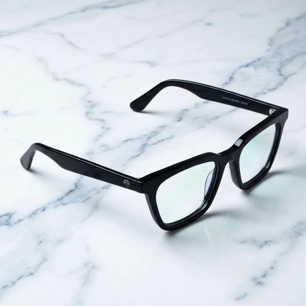 Lentes ópticos Oliver Negro sobre mármol blanco elegante armazón premium Bonoboss #editorial_armazon #color_negro
