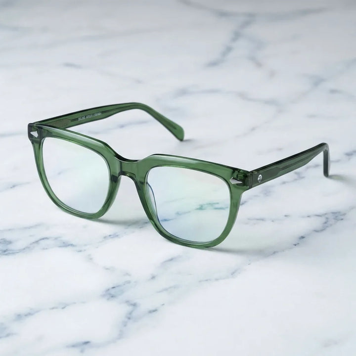 Lentes ópticos Selkie Verde sobre mármol blanco elegante armazón premium Bonoboss #editorial_armazon #color_verde