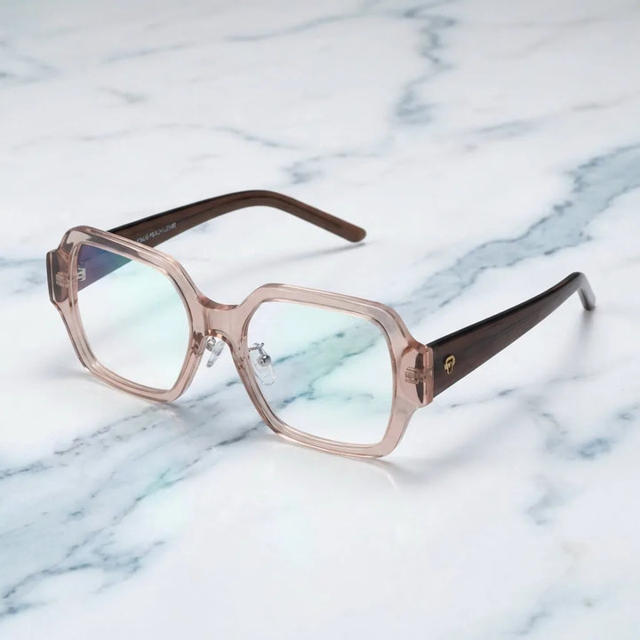 Lentes ópticos Venus Champagne sobre mármol blanco elegante armazón premium Bonoboss #editorial_armazon #color_champagne