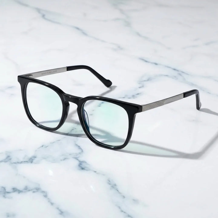 Lentes ópticos Waimea Steel Optic Negro sobre mármol blanco elegante armazón premium Bonoboss #editorial_armazon #color_negro