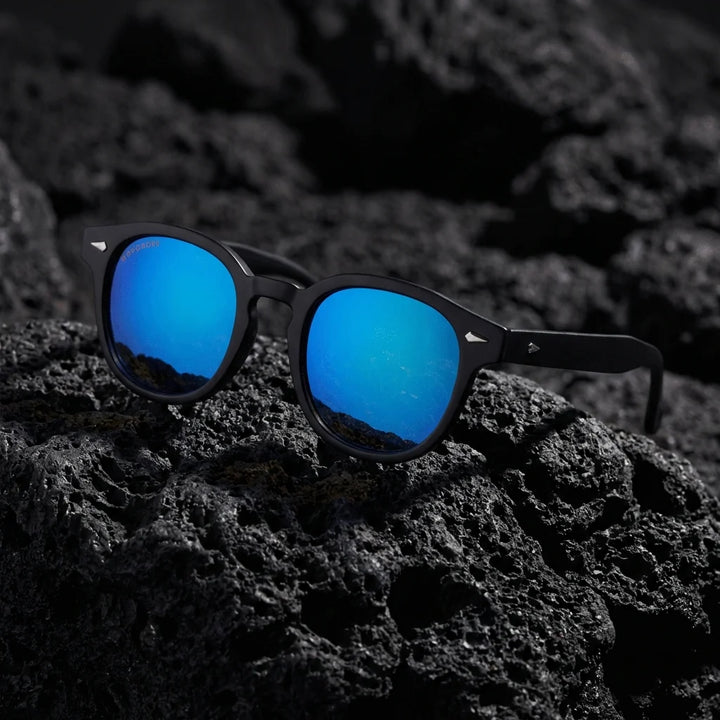 Lentes sol Waimea RPET polarizados UV400 marco reciclado del oceano dark sky sobre piedra volcanica textura mineral Bonoboss #editorial_detail1 #color_espejado-azul
