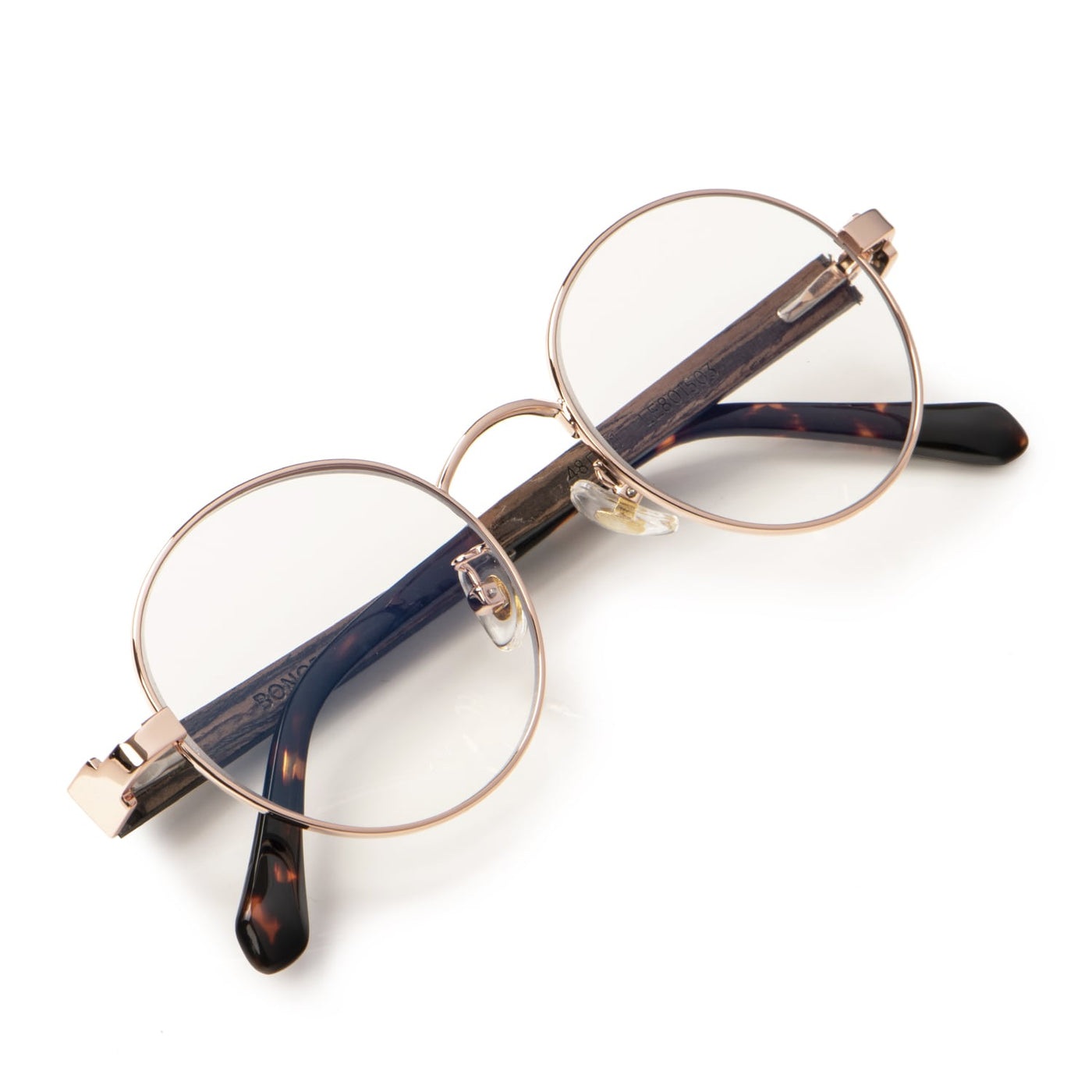 Foto diagonal de lentes ópticos redondos de moda para hombre y mujer. Lentes con receta oftalmológica.